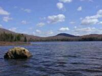 Small lake with glacial hills in the background.