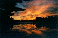 Witness a sunset over an unspoiled backcountry pond.